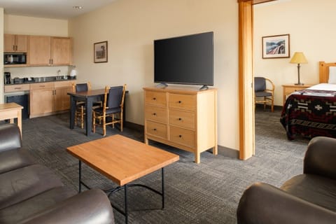 Spread out in a roomy suite with dining, TV, and comfort
