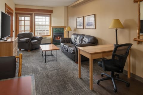 Relax by the fireplace in a cozy lounge with plenty of seating