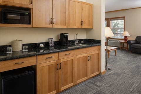 Prep quick bites with granite counters and a handy sink.