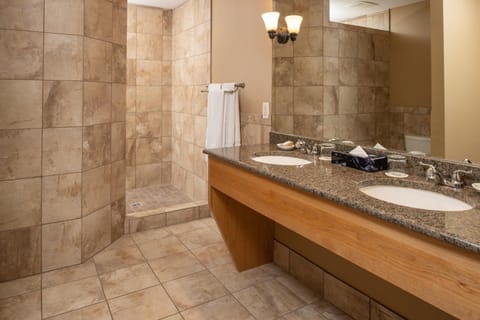Refresh in a spacious walk-in shower and double vanity.