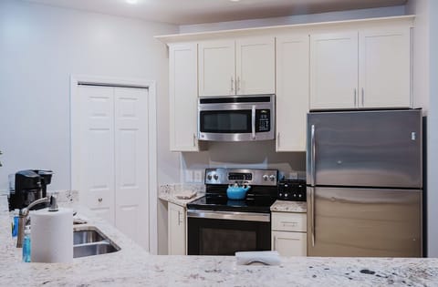 Complete w/ dishes, pots & pans, utensils, dish soap, detergent & paper towels.