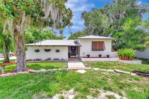 multi-unit home with tasteful landscaping.