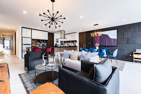 Sleek living room designed for comfort, with plenty of seating and natural light