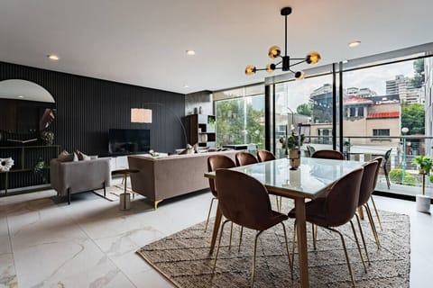 Dine in style at this chic table, surrounded by natural light and artful touches