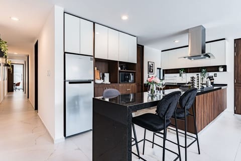 Fully equipped kitchen with sleek cabinetry and premium appliances for gourmet meals.