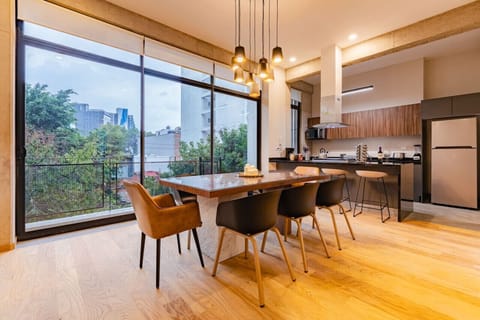 Enjoy dining in style with large windows showcasing the surrounding greenery.