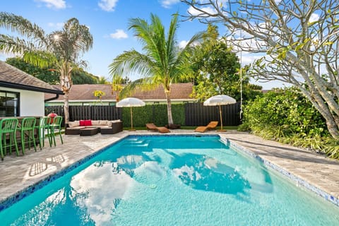 Enjoy our tranquil backyard oasis lounging by the pool