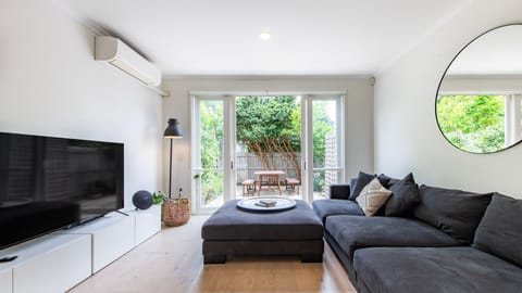 Spacious and Elegant Living Area with TV