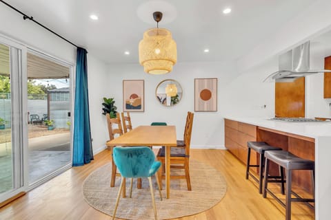Dining table with direct access to the backyard, perfect for enjoying meals.