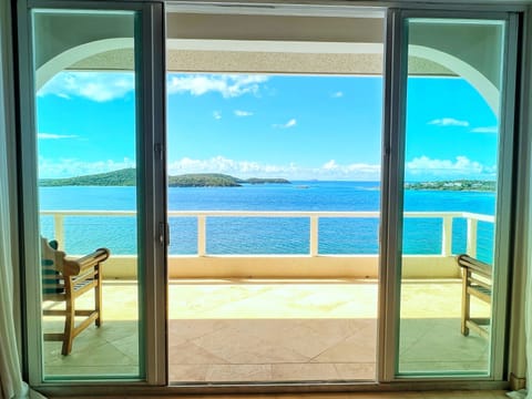 Slide open the glass doors and you'll hear the ocean crashing below.
