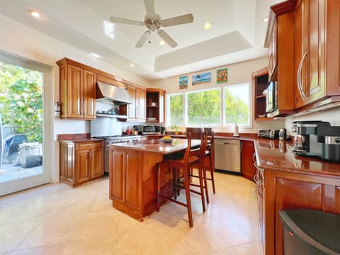 A kitchen so sleek, you might actually enjoy doing the dishes. The professional gas range will be a private chef's dream.