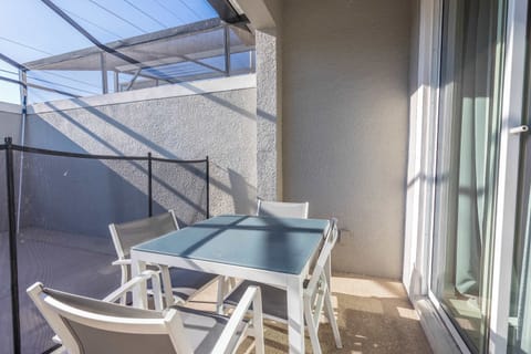 Outdoor dining area on the patio, great for enjoying meals by the pool.