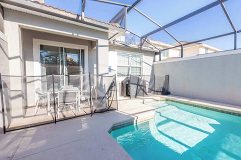 Private pool with a screen enclosure for year-round enjoyment.