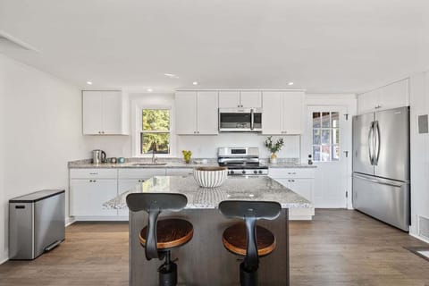 Updated kitchen with granite countertops and stainless steel appliances