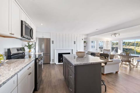 The kitchen leads directly into the living room
