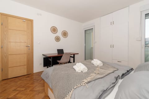Room view with a desk and wardrobe, clean layout and soft natural light.
