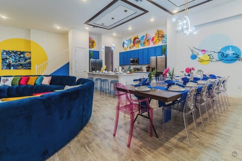 Dining seats large groups. Modern lights, bold decor, open design, celebrations.