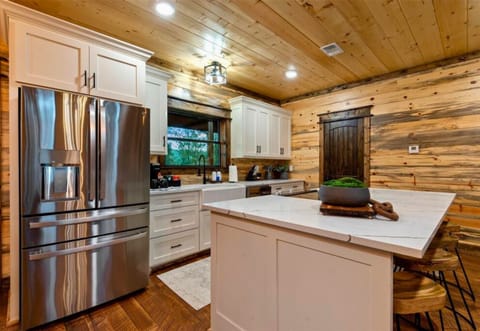 Stainless steel appliances and ample counter space make this kitchen a chef’s dream and perfect for group cooking.