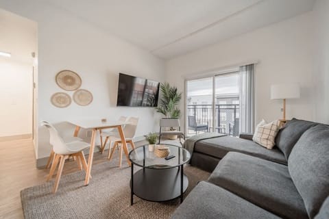 The living room’s cozy vibe makes it the perfect spot to relax, with ample seating and a warm ambiance.
