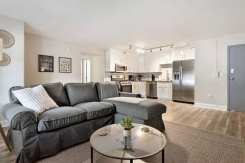 The living room’s cozy vibe makes it the perfect spot to relax, with ample seating and a warm ambiance.