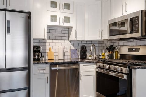 Stainless steel appliances with new kitchen cabinets