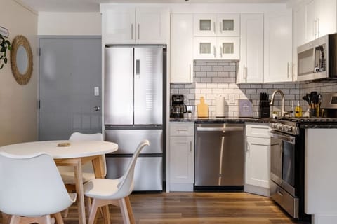 The kitchen’s open layout allows you to move freely as you prepare meals, with everything you need at your fingertips.