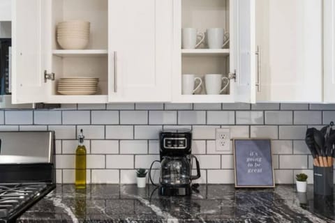 As you open the kitchen, you discover an assortment of coffee pods, and sugar, ensuring you have everything you need for a perfect morning or afternoon pick-me-up.
