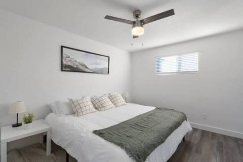 The bedroom’s serene ambiance invites you to relax, with a plush bed that promises a restful night's sleep.