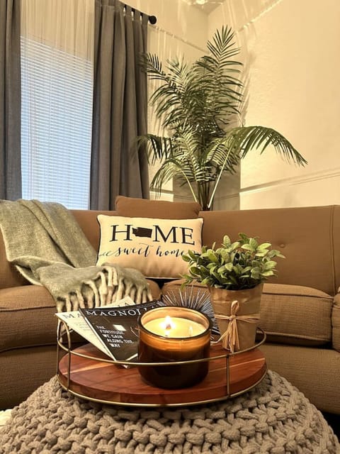 Guests can enjoy cozy seating, glowing candles, and a peaceful reading space.