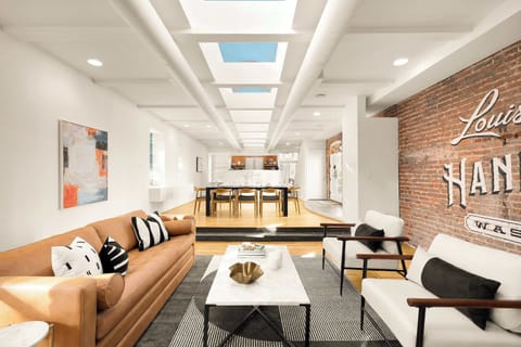 Relax in the spacious living room, where open, airy design meets the timeless stories of Washington’s well-to-do and their trusted Laundry.