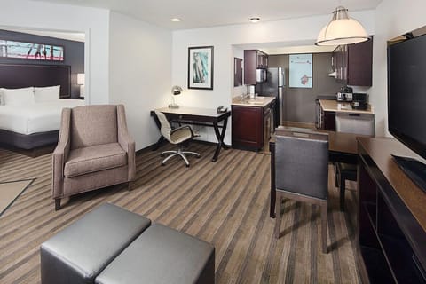 Settle in with a roomy suite, kitchenette, and work desk.