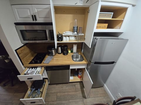 Fully stocked with the basics to whip up a home-style meal. Appliances: Coffee m