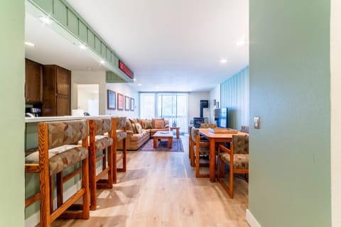 Open living area with kitchen, dining area and living room.
