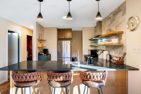 Kitchen with 3 barstools
