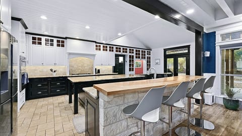 The bar top offers additional seating for 4.