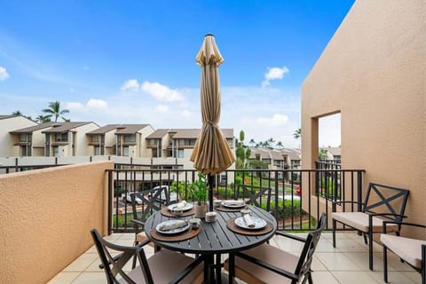 Outdoor dining terrace with cushioned seating, warm island breezes, and open resort views.