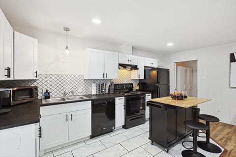 
Kitchen with ample counter space and appliances. The perfect space to create and enjoy delicious meals! 