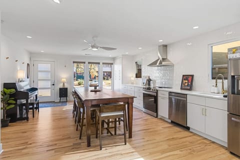 The kitchen is fully equipped with high-end appliances and all the cooking essentials you may need. Enjoy meals at the dining table.