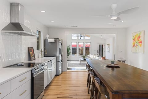 The kitchen is fully equipped with high-end appliances and all the cooking essentials you may need. Enjoy meals at the dining table.