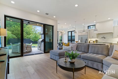 Disconnect to reconnect—this cozy living space seamlessly blends indoor comfort with outdoor tranquility, inviting you to trade screen time for serene green views.