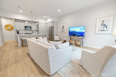 Enjoy the open-concept living and kitchen area, designed for seamless flow and a spacious, inviting atmosphere perfect for family gatherings and entertaining. Gulf Coast vacation home