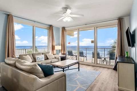 Relax in this modern living room with ocean views and direct balcony access.