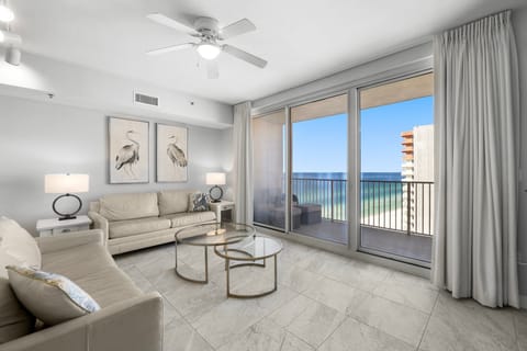 Relax in this modern living room with ocean views and natural light.
