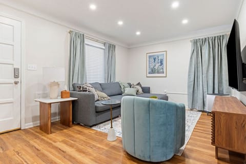 Inviting living space featuring chic decor, plush seating, and a calming modern design—ideal for a peaceful getaway.