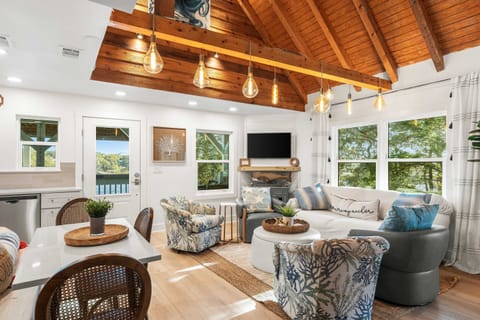 A gathering space with ample seating.  A comfortable sofa to sink into for an afternoon nap.  Or swivel chairs to facilitate conversations between the kitchen and the living space.