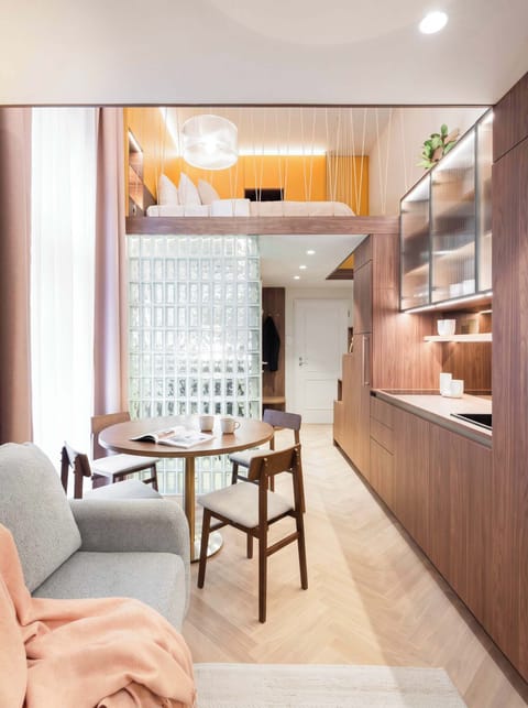 Loft apartment with living room in the lower floor and two queen size beds in the upper bedroom