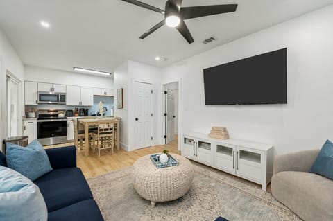 Open-concept living at its best! Relax in the cozy living room, cook up something delicious in the modern kitchen, and enjoy meals together in the dining area—all in one inviting space!