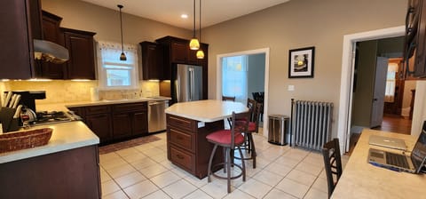 Well-equipped Kitchen with Island and Workspace.  Dish soap, dishwasher pods, garbage bags, tinfoil, plastic wrap, zip lock bags. Starter supply of coffee K-Cups, and paper towel.
