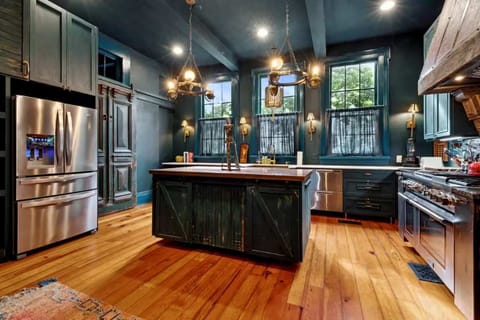 A true chef’s kitchen featuring a Thermador Professional range, dual dishwashers, and a sprawling island perfect for prepping or gathering.