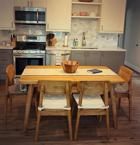 Dining Table expands at the center to seat 8